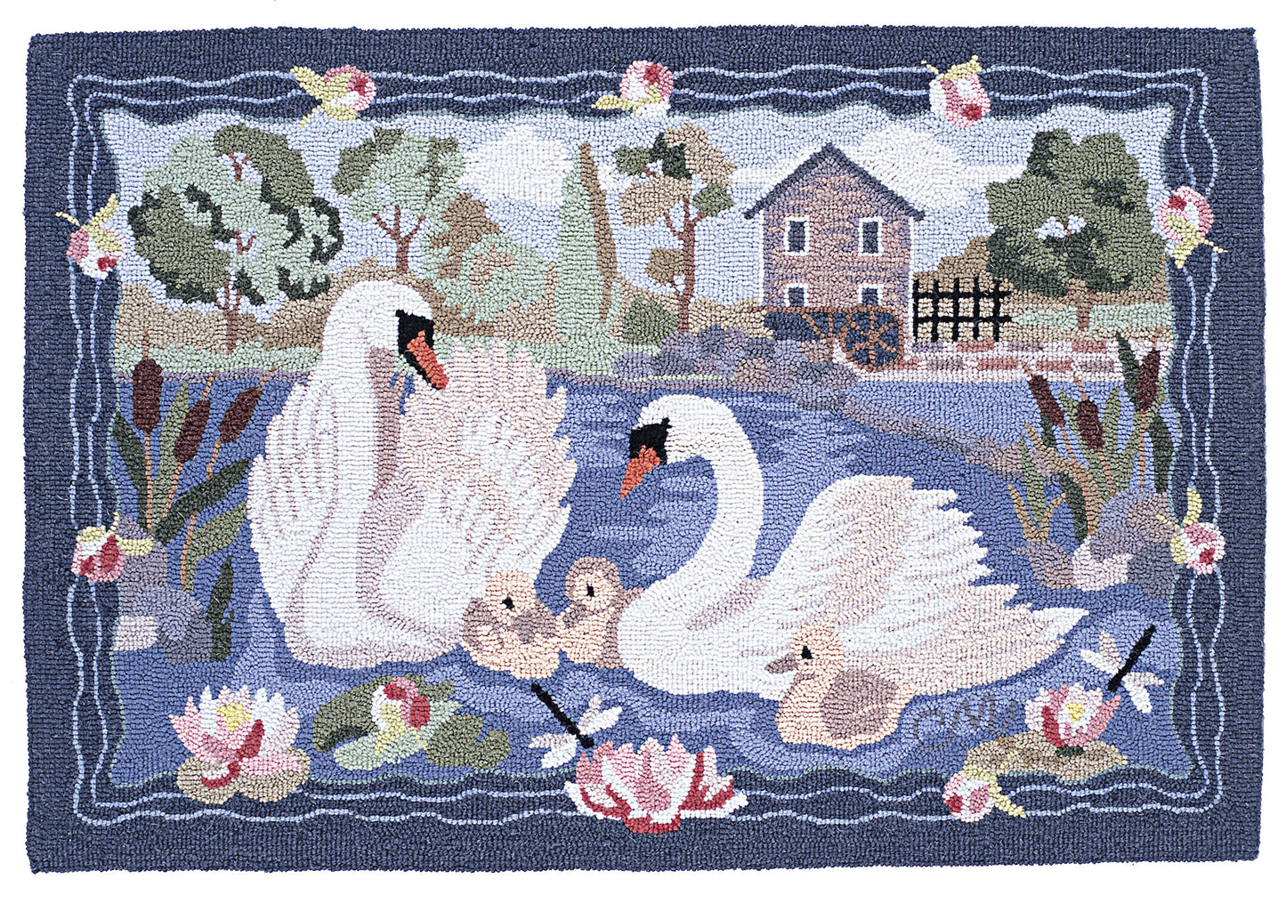A hand-hooked rug featuring a family of white swans, two cygnets, reeds, water lilies, a small house, and a water wheel by a blue pond, bordered by a dark blue frame with pink flowers.