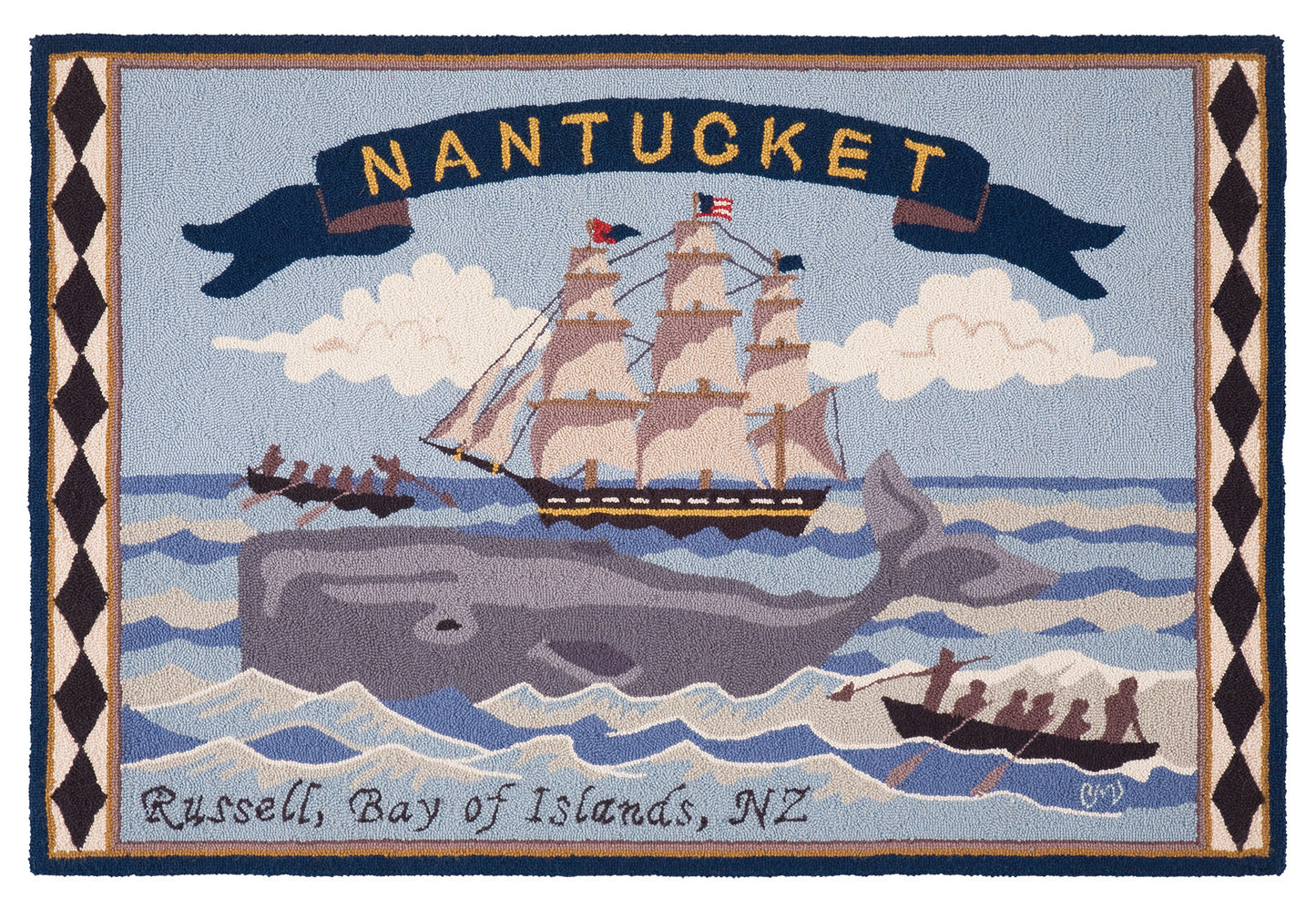 A hand-hooked rug featuring a Nantucket maritime scene with a large gray whale, a sailing ship, small boats, clouds, and a banner reading “NANTUCKET.” The bottom edge includes the text “Russell, Bay of Islands, NZ.