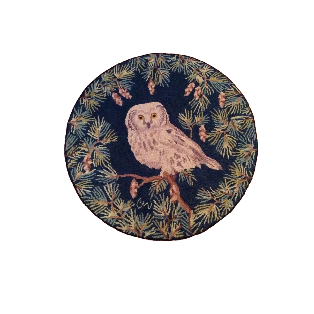 Round coaster with an owl design on a dark blue background