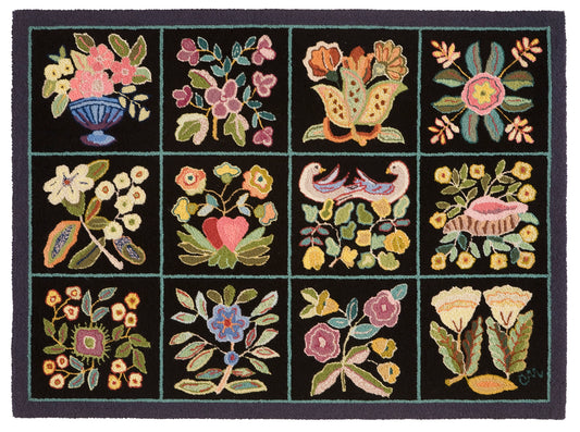 Decorative rug with floral and bird patterns on a black background