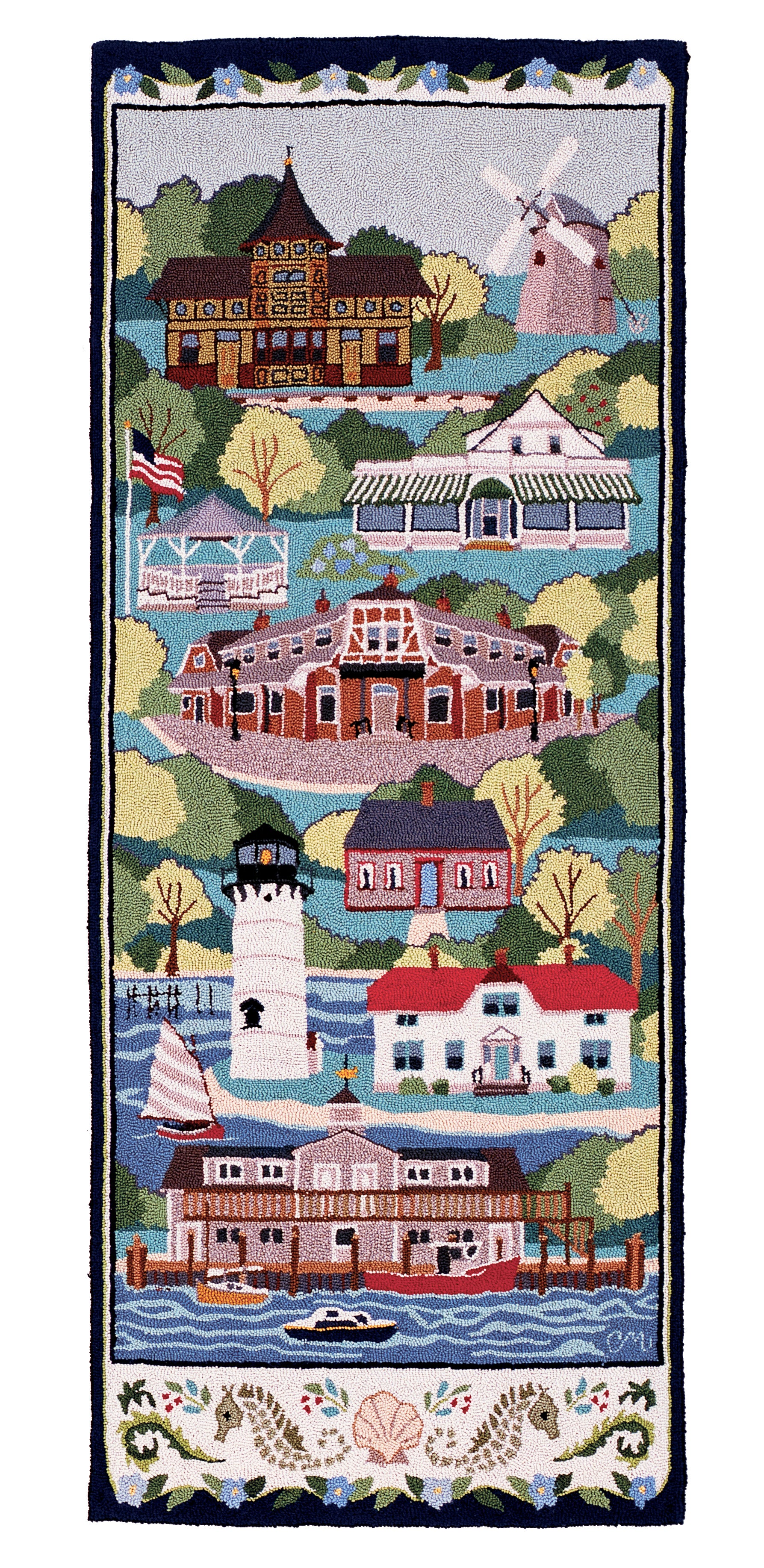 Decorative hand-hooked rug with a collage of houses, boats, and a lighthouse.