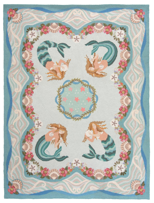 Decorative rug with mermaid design and floral border on a light blue background