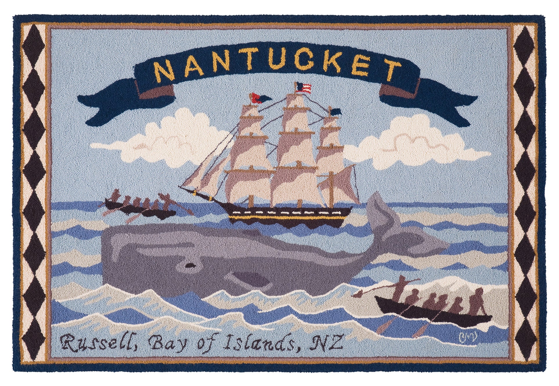A hand-hooked rug featuring a Nantucket maritime scene with a large gray whale, a sailing ship, small boats, clouds, and a banner reading “NANTUCKET.” The bottom edge includes the text “Russell, Bay of Islands, NZ.