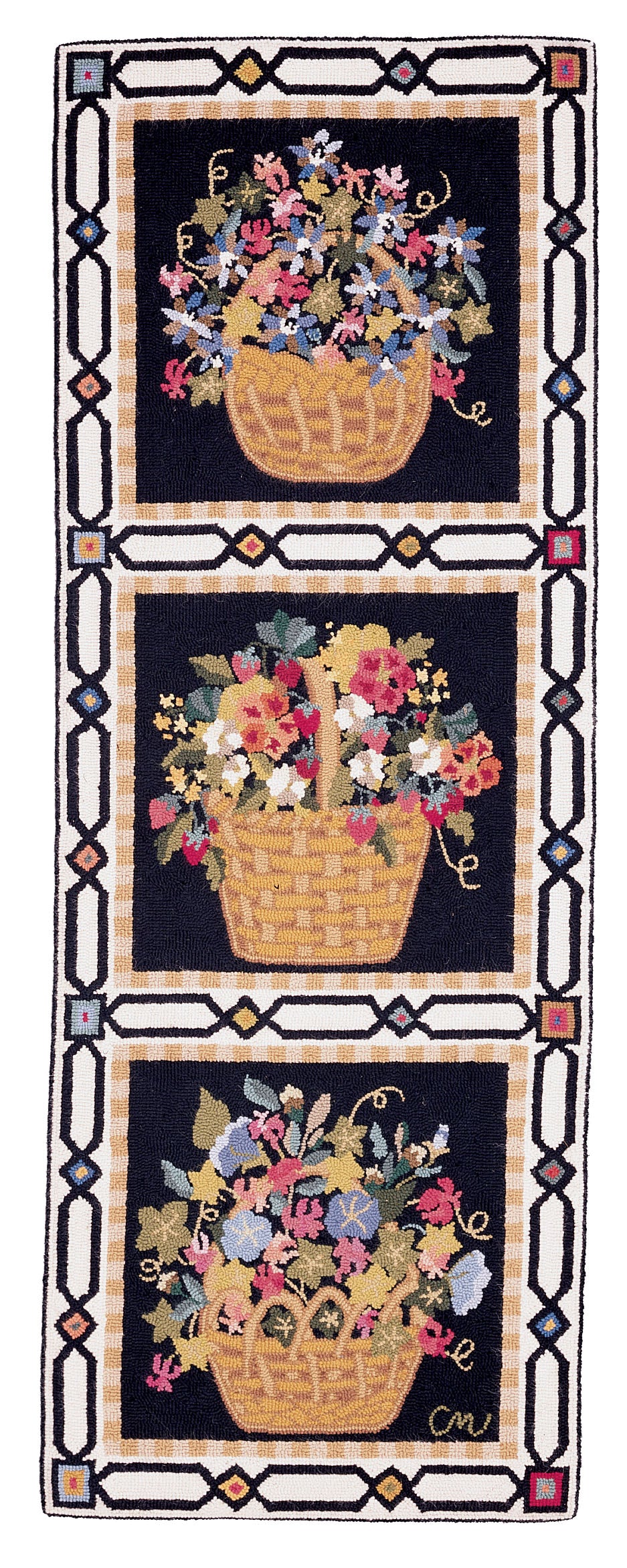 A hand-hooked runner featuring three stacked baskets of colorful wildflowers on a black background, framed by a geometric border with beige, black, and small red accents.