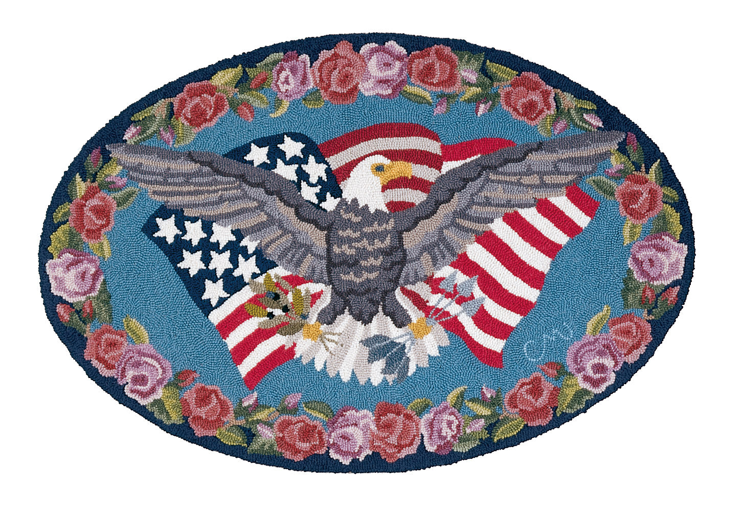 Decorative rug with an eagle and American flag design surrounded by flowers on a blue background
