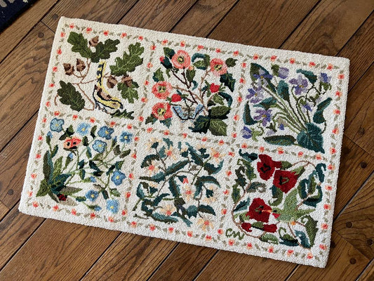 Decorative rug with floral patterns on a wooden floor