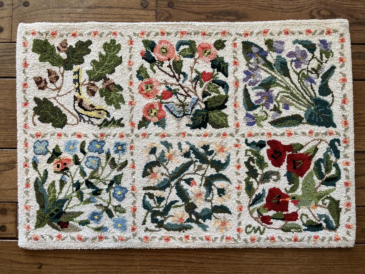 Decorative rug with floral patterns on a wooden floor