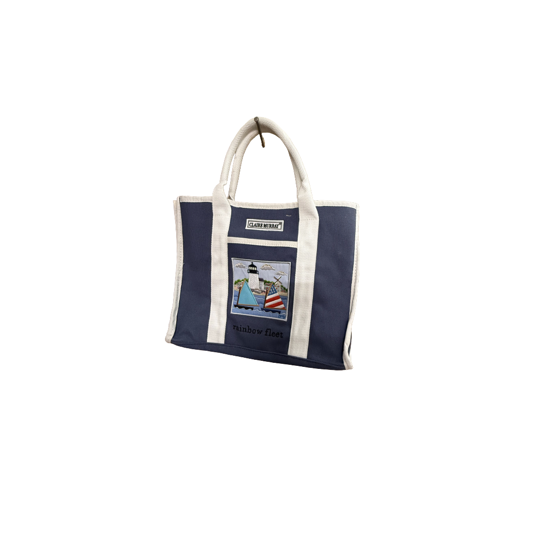 Navy tote bag with a white handle on a white background