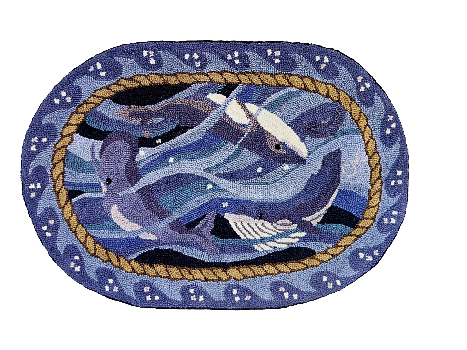 An oval hand-hooked rug featuring a blue whales swimming in the center, bordered by a rope motif and white and blue waves  on a light blue/gray background.