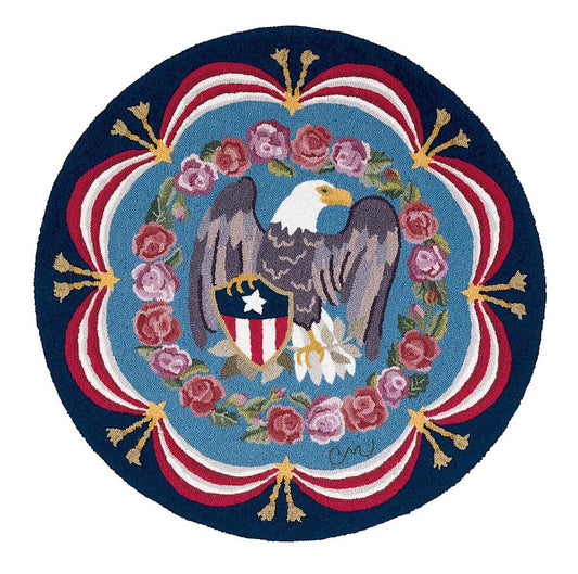 Roundel with a bald eagle and shield design, surrounded by flowers and decorative elements on a blue background.
