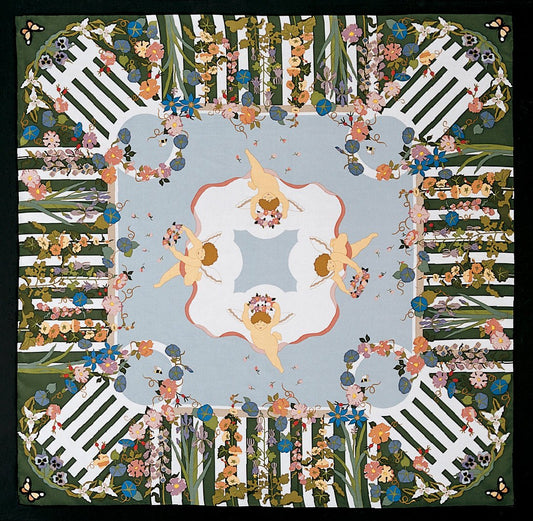 This is a square silk scarf featuring a white picket fence bordered by colorful flowers and winged cherubs in the center.